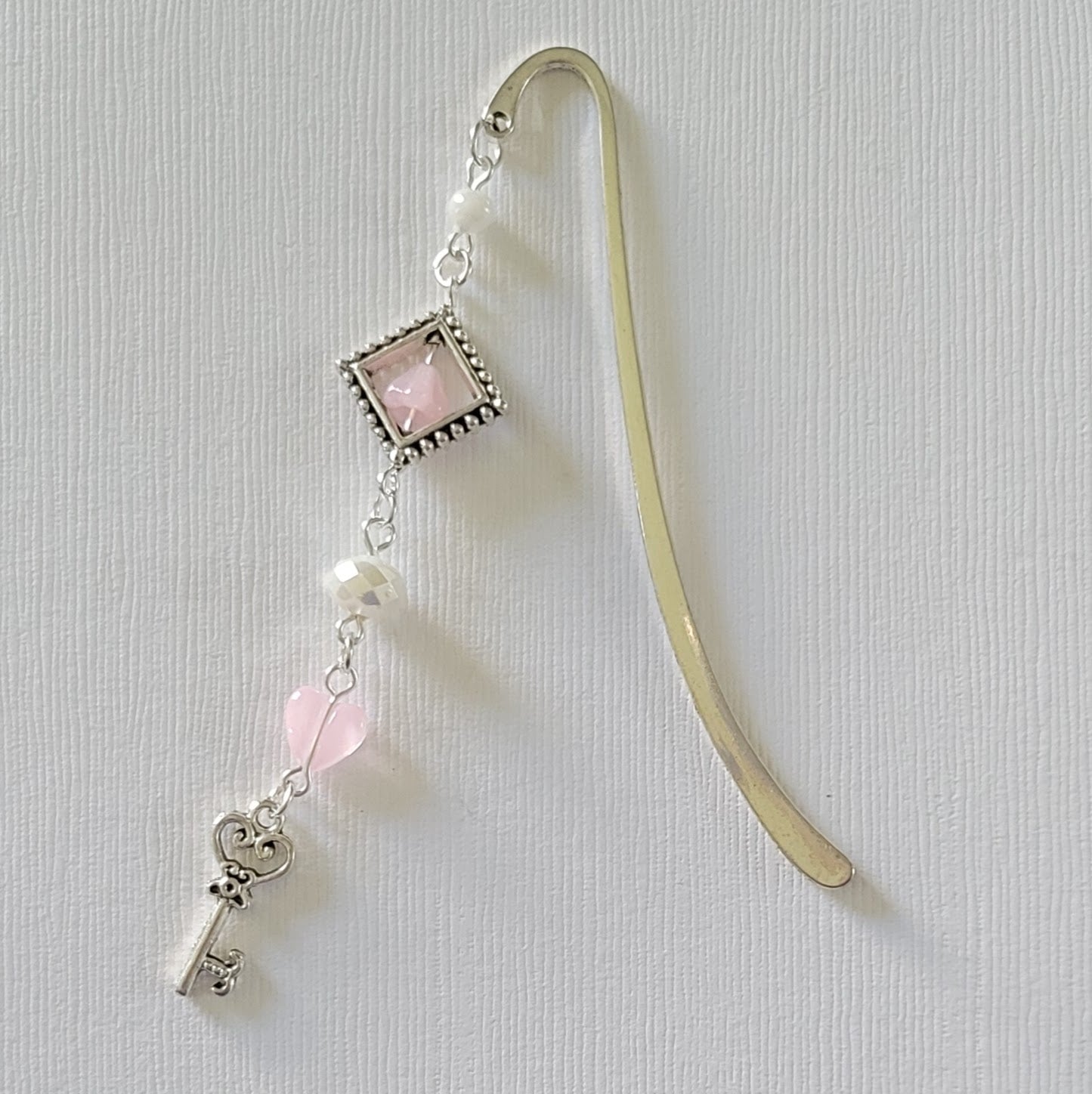 Silver bookmark with key charm